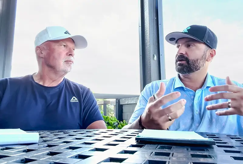 Brian and Dan talking outside