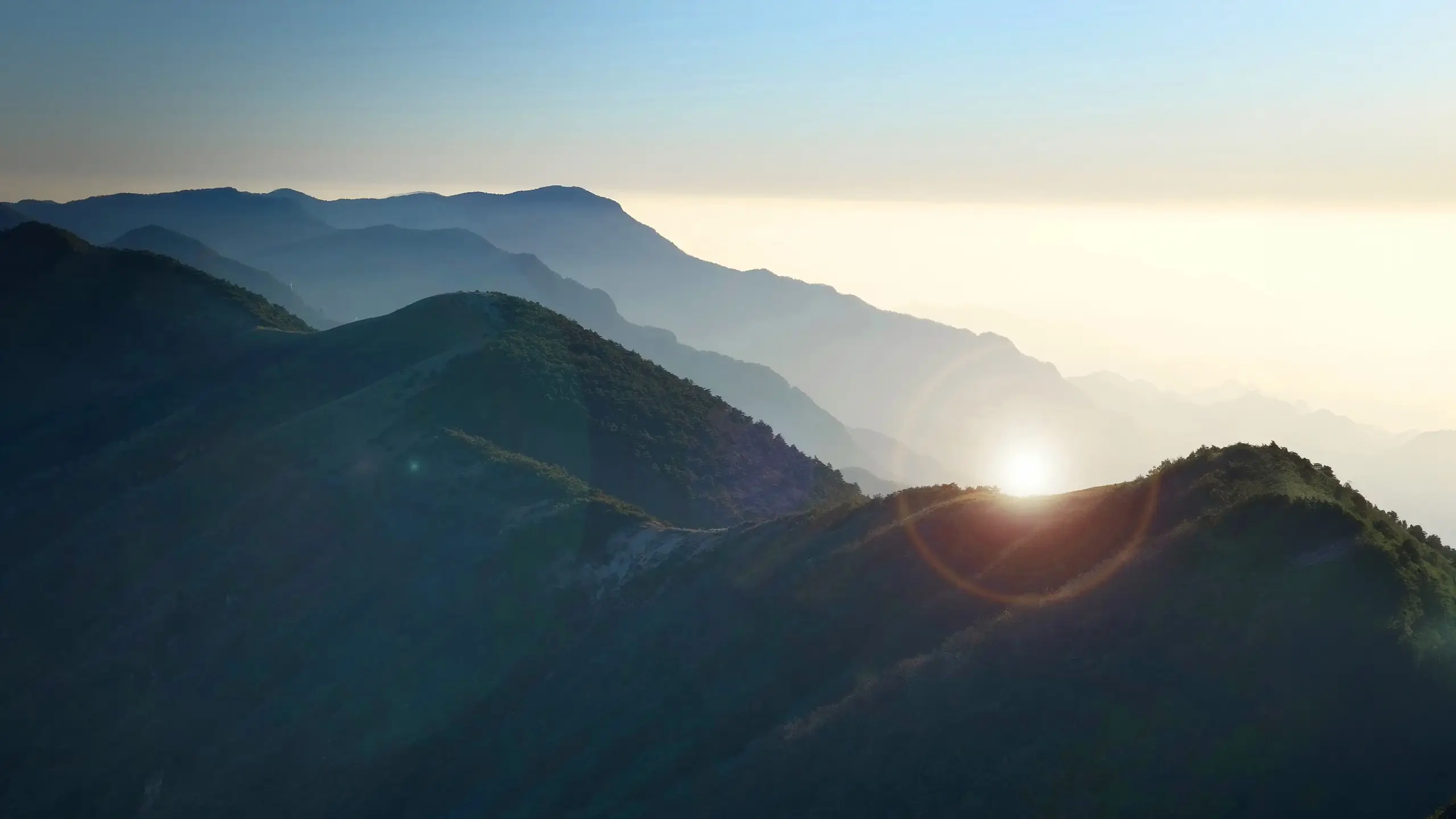 sunrise over green hills